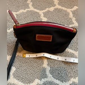 Dooney & Bourke Black Wristlet with Red Zipper